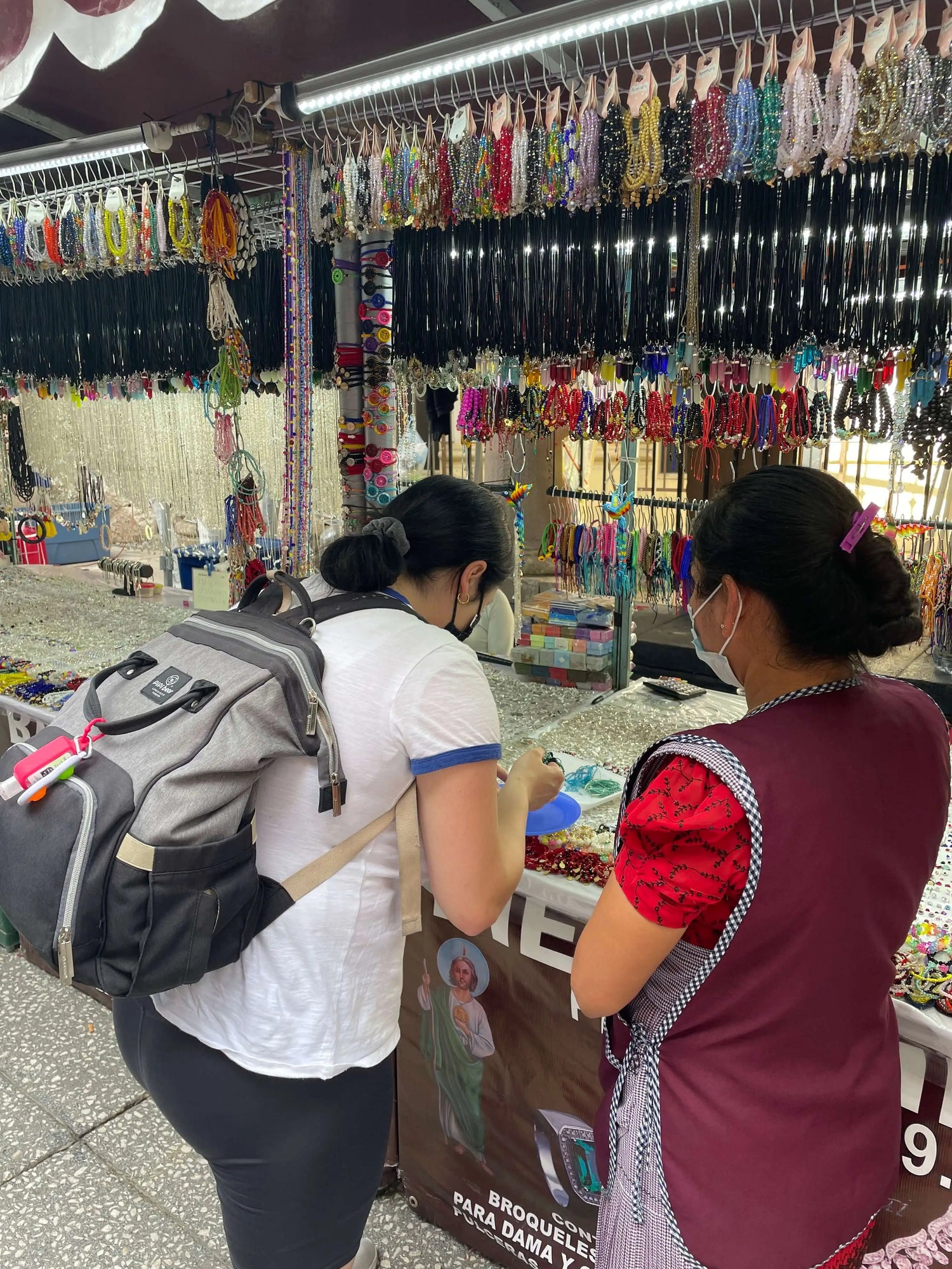 Hand picking cultural jewelry from Mexico.