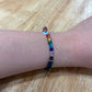 White Adult "Evil Eye" Bracelet with Chakra Colors